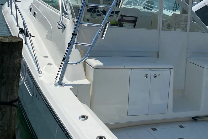 A sport fishing boat berthed at a Hamptons marina, freshly detailed and ready for the season