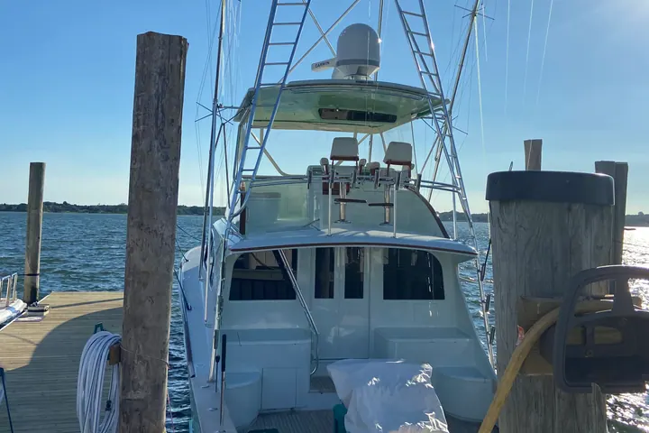 A working harbour on the eastern tip of Long Island, commercial and sport fishing boats moored along the pilings